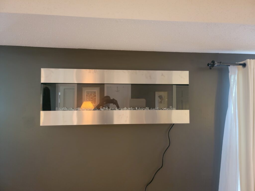 Electric fireplace mounted on a living room wall