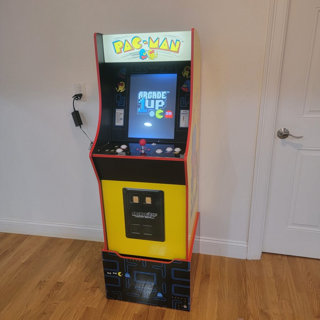 Pac-Man arcade cabinet assembled and powered on